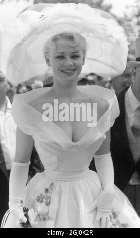 Royal Ascot - First Day. Stage and television star Sabrina kept cool in this large-brimmed hat and off the shoulder dress with plunging neckline at Ascot today, the first day of the Royal Ascot race meeting. 18 June 1957 Stock Photo