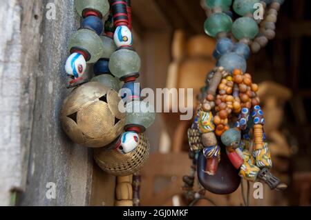 Africa, Benin, Ganvie. Tofinu voodoo village on Lake Nokoue. Traditional souvenir beaded necklaces. Stock Photo