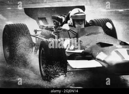 Watkins Glen New York John Surtees heads into turn one during first day practice to prepare for the United States Grand Prix to be run. 4 October 1969 Stock Photo