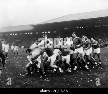 Cester (France , dark shirt) goes in to tackle Laidlaw (Scotland) with MacLauchlan and Brown in attendance , during the Scotland v France opening Five Nations championship match at Murrayfield , Scotland on 10th January 1970 . Also in the picture are Stagg (Scotland) , Azarette (France) , Telfer and Lauder (Scotland) and Bastiat (France) . 12th January 1970 Stock Photo