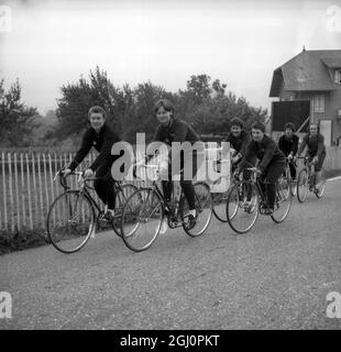 British girl cyclists prepare. The British women's cycling team taking part in the 1964 World Cycling Championships- the road events of which begin in the French Alps tomorrow and continue for four days-pictured during a training spin here this morning, left to right, Mrs Beryl Burton, 1963 World Pursuit Champion, A Illingworth, P Pepper, C Cary, V Runsworth, and S Beardon. 2 September 1964 Stock Photo