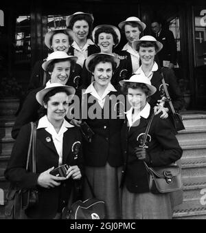 Some of the British girl athletes bound for the Empire Games in Vancouver , seen leaving their hotel at Victoria . From left to right ( front row ) Ann Pashley , Jean Desforges and Pat Seaborne . Second row : Sheila Lerwill , Shirley Burgess and Shirley Hampton . Back row : Ann Johnson , Heather Armitage and Mrs Allday . The girls are flying to Canada from London Airport later this morning , London , England . 20 July 1954 Stock Photo
