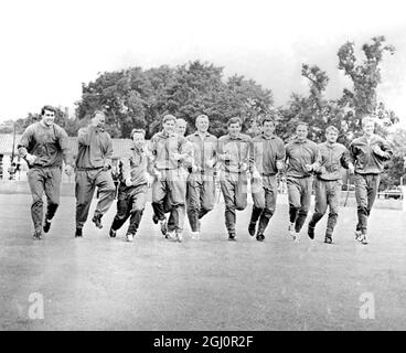 England team limbers up Wembley ; Members of the England World Cup team limber up at the Wembley Vale Sports ground today , for their world cup semi - final against Portugal tonight , at the Wembley Stadium . Left to right ; Geoff Hurst, Ray Wilson , Nobby Stiles , Alan Ball , Bobby Charlton , Bobby Moore , Martin Peters , Gordon Banks , George Cohen , Roger Hunt , Jack Charlton . 26 July 1966 Stock Photo