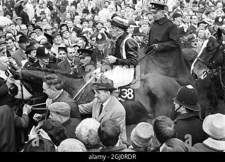 Grand national 1967 A steaming and tired Foinavon and proud jeckey John Buckingham is led into the winners enclosure after winning the 1967 Grand National 1967 Grand National steeplechase at Aintree . Foinavon , a 100-1 outsider ridden by John Buckingham , came from the back of the field to win the event by 15 lengths after a disastrous pileup at the 23rd fence brought down all the leaders. second was Honey End with jockey Josh Gifford ; third was Red Alligator with jockey Brian Fletcher and fourth was Greek Scholar with jockey Terry Biddlecombe . 8 April 1967 Stock Photo