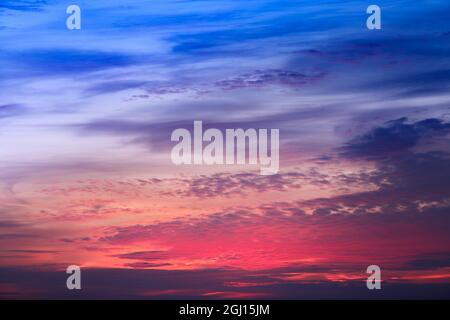 The sky with clouds at sunset. Beautiful heavenly sunset over the city Stock Photo