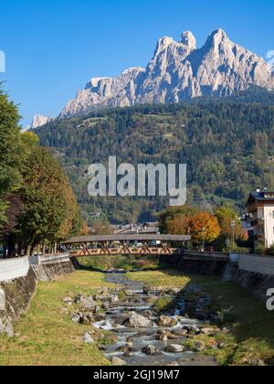 River Cismon, in the background Pale di San Martino. Fiera di Primiero in the valley of Primiero in the Dolomites of Trentino, Italy. Stock Photo