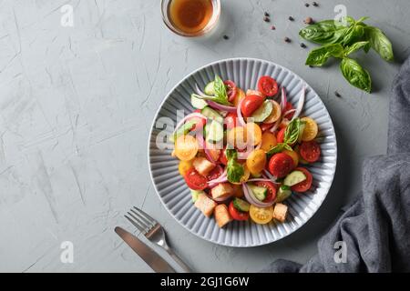 Tuscan Panzanella with tomatoes and bread. Concept for a tasty and healthy meal. Traditional Italian cuisine. Stock Photo