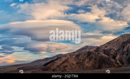 USA, California, Death Valley National Park, Panorama of lenticular clouds at sunset Stock Photo