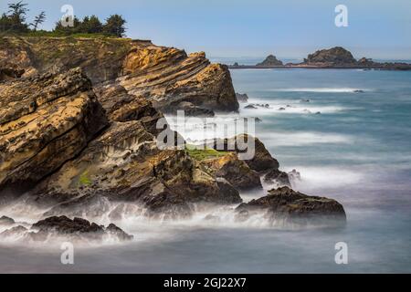 Long exposure of wave action along coastline, Shore Acres State Park, Cape Arago Highway, Coos Bay, Oregon Stock Photo