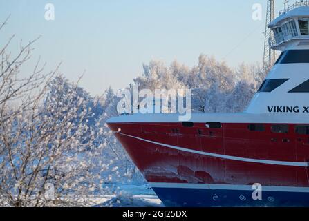 Helsinki, Finland - January 15, 2021: M/S Viking XPRS ferry arriving to Helsinki from Tallinn in extremely cold winter conditions through narrow Kusta Stock Photo