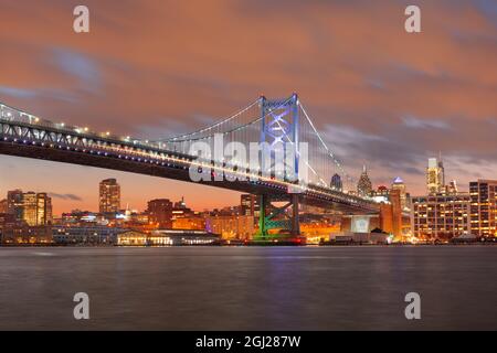 Philadelphia, Pennsylvania, USA skyline on the Delaware river with Ben Franklin Bridge at night. Stock Photo