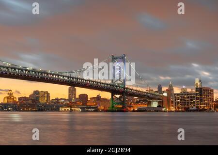 Philadelphia, Pennsylvania, USA skyline on the Delaware river with Ben Franklin Bridge at night. Stock Photo