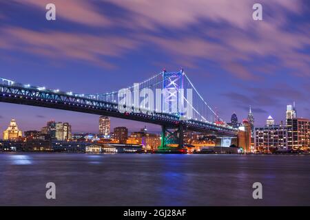 Philadelphia, Pennsylvania, USA skyline on the Delaware river with Ben Franklin Bridge at night. Stock Photo