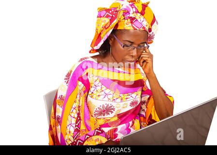 beautiful adult woman sitting using laptop and serious face thinking about the question, very confused idea Stock Photo