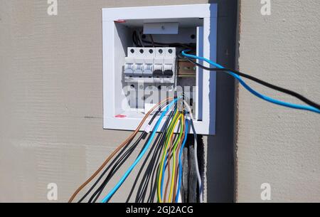 electricity distribution box with wires and circuit breakers (fuse box) Stock Photo