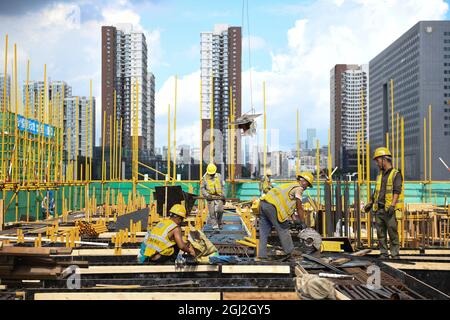 (210908) -- SHENZHEN, Sept. 8, 2021 (Xinhua) -- Workers operate at the construction site for a transaction center in Qianhai, Shenzhen City, south China's Guangdong Province, on Sept. 8, 2021. China's central authorities have issued a new plan for further developing a cooperation zone for the southern metropolis of Shenzhen and the Hong Kong Special Administrative Region (HKSAR). According to the plan, the reform and opening up of the Qianhai Shenzhen-Hong Kong Modern Service Industry Cooperation Zone will be comprehensively deepened. The plan, issued by the Communist Party of China Central Stock Photo