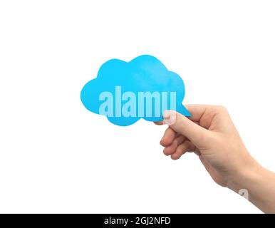 Blue cloud speech bubble in hand isolated on a white background. Giving feedback, communication concept. Empty cardboard text box mockup photo Stock Photo