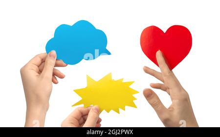 Collage of speech bubble in woman hands, shape of cloud, lightning and heart, isolated on white background Stock Photo