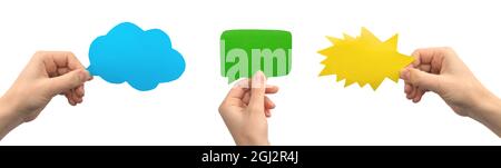 Group of multicolored empty cardboard and paper mockup speech bubbles in hands, banner, giving feedback concept, isolated on a white background Stock Photo