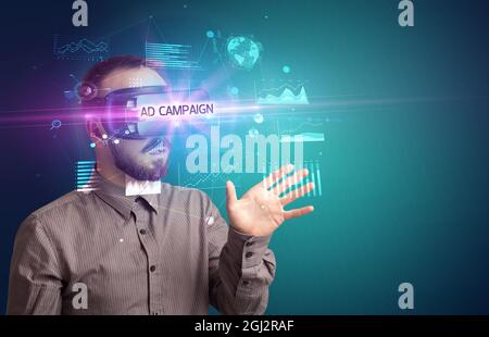 Businessman looking through Virtual Reality glasses Stock Photo