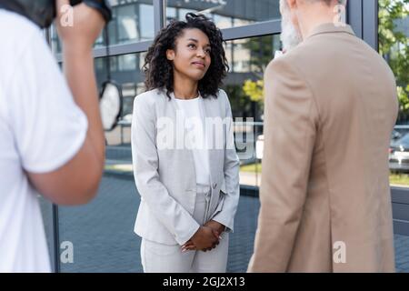 reporter interviewing pretty african american businesswoman