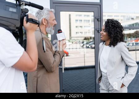 reporter interviewing pretty african american businesswoman