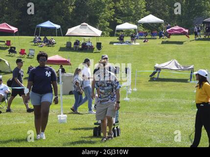 Cooperstown, United States. 08th Sep, 2021. Small number of fans dot the hillside on the grounds prior to the start of Major League Baseball's Hall of Fame Induction Ceremony 2021 for the 2020 inductees in Cooperstown, New York on Wednesday, September 8, 2021. Photo by Pat Benic/UPI Credit: UPI/Alamy Live News Stock Photo