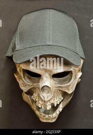 Skull Cap Face Mask Isolated Against Brown-Gray Background. Stock Photo