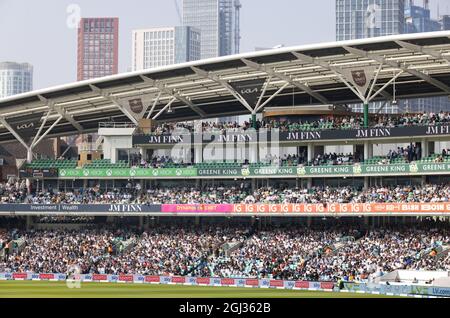 The JM Finn stand, with crowds,The Oval Cricket Ground, aka the Kia Oval, home of Surrey County Cricket Club, Kennington London UK