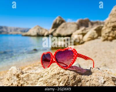 Red sunglasses glasses Beritnica beach near Metajna on Pag island in Croatia Europe Stock Photo