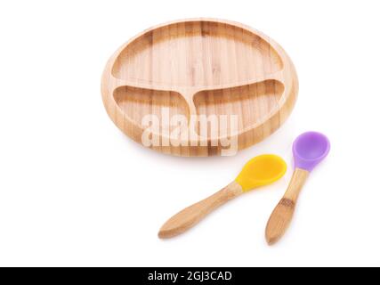 Wooden bowl. Bamboo plate with spoon isolated on white background Stock Photo