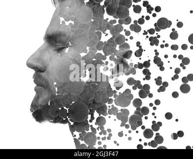 A black and white profile portrait of a man combined with floating 3d spheres. Stock Photo