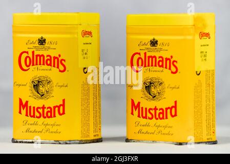 Colman's English Mustard tins arranged on a white background. Stock Photo