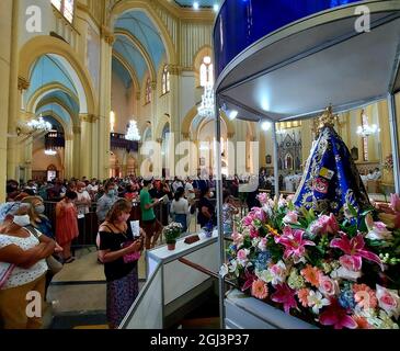 Santos, Sao Paulo, Brasil. 8th Sep, 2021. (INT) Homage to Our Lady of Monte Serrat, patron saint of Santos. September 8, 2021, Santos, Sao Paulo, Brazil: Faithful follow the trajectory of the image of Our Lady of Monte Serrat, patron saint of the city of Santos, which leaves the cathedral and returns to the top of Monte Serrat, on the coast of Sao Paulo, on Wednesday (8), a municipal holiday. (Credit Image: © Luigi Bongiovanni/TheNEWS2 via ZUMA Press Wire) Stock Photo