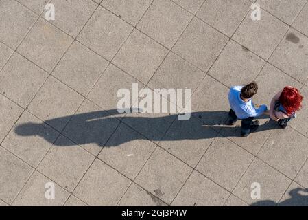 Long shadows of two people from above - aerial Stock Photo - Alamy
