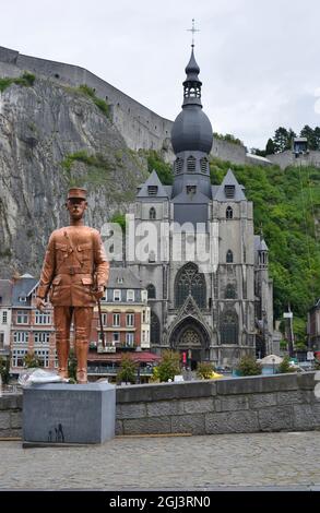 Dinant, Belgium 08-17-2014 statue and memorial of Charles de Gaulle with view to the Church and the Fortress Stock Photo