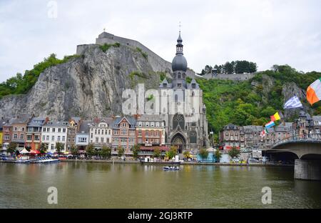 Dinant, Belgium 08-17-2014 view over the river Maas to the Church and the Fortress Stock Photo