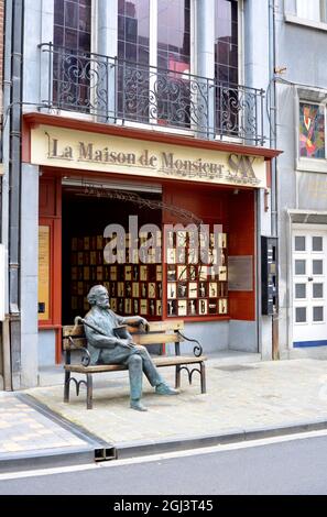 Dinant, Belgium 08-17-2014 Adolphe Sax Museum with sculpture of him on a bench in the street Stock Photo