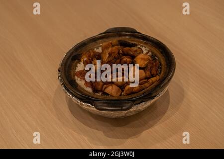 Hot bowl of Chicken claypot rice, Singapo Stock Photo