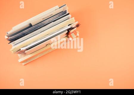 Close up of documents isolated on orange background with free space for text Stock Photo