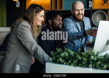 business meeting. A young development team is discussing a new project. Multiracial team of professionals Stock Photo