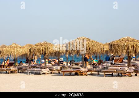 NAVODAR, ROMANIA - Aug 08, 2021: The tourists on the beach in Mamaia Nord, Navodar, Romania Stock Photo