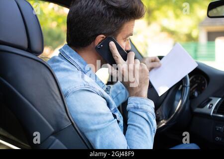 man driving car and calling from smartphone Stock Photo