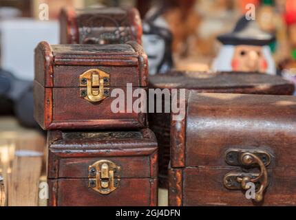 Image of artisanal chests on a market stall. Stock Photo