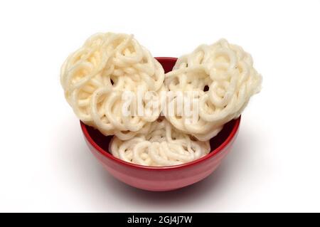 Kerupuk crackers in a red bowl on a white background Stock Photo