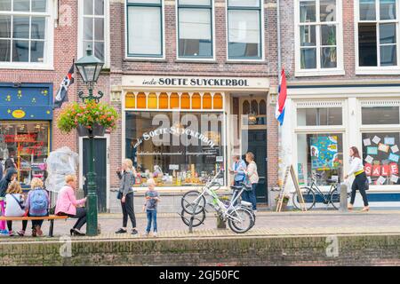 Alkmaar Netherlands - August 18 2012; Picturesque town of historic monuments and points of interest renown for cheese.shop and people in street scene. Stock Photo