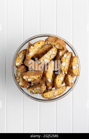 Italian cantuccini cookies. Sweet dried biscuits with almonds on white table. Stock Photo