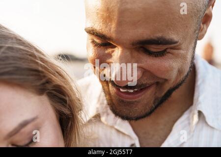 Close up portrait of smiling hugging couple Stock Photo