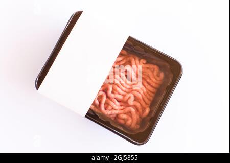 minced meat in vacuum packaging on a white background. top view. logo layout for design Stock Photo