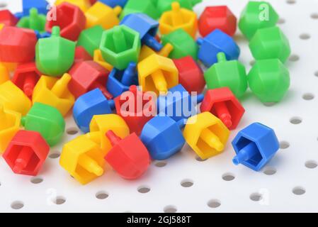 Close up of colorful plastic mosaic puzzle board game Stock Photo